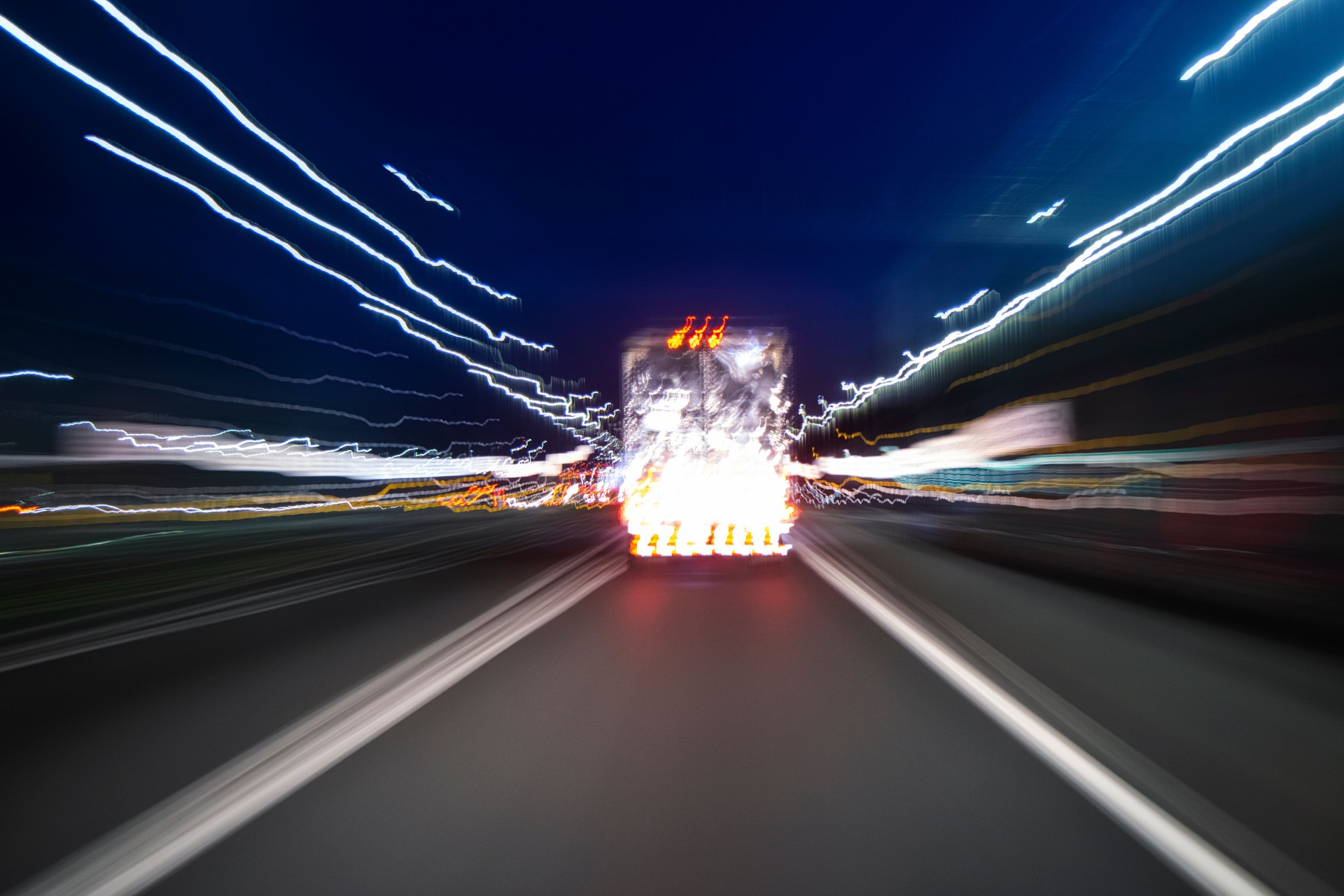 Motion blur of following a semi-tractor trailer at night.